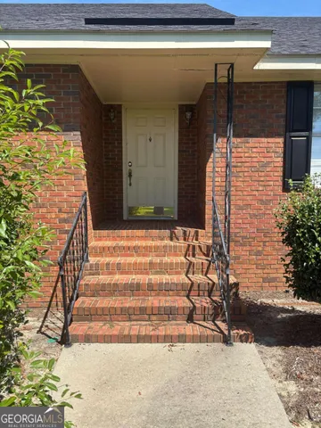 a view of a garden with an outdoor space
