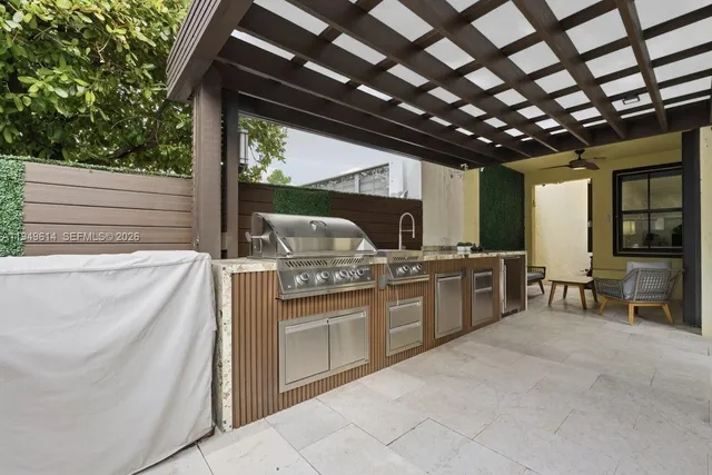a open kitchen with stainless steel appliances granite countertop a sink and a counter top