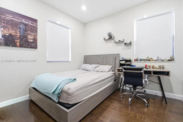 a bedroom with a bed and a table in it