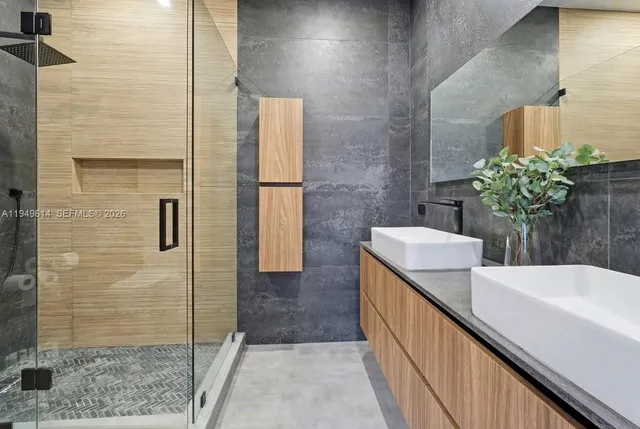 a bathroom with a sink and shower