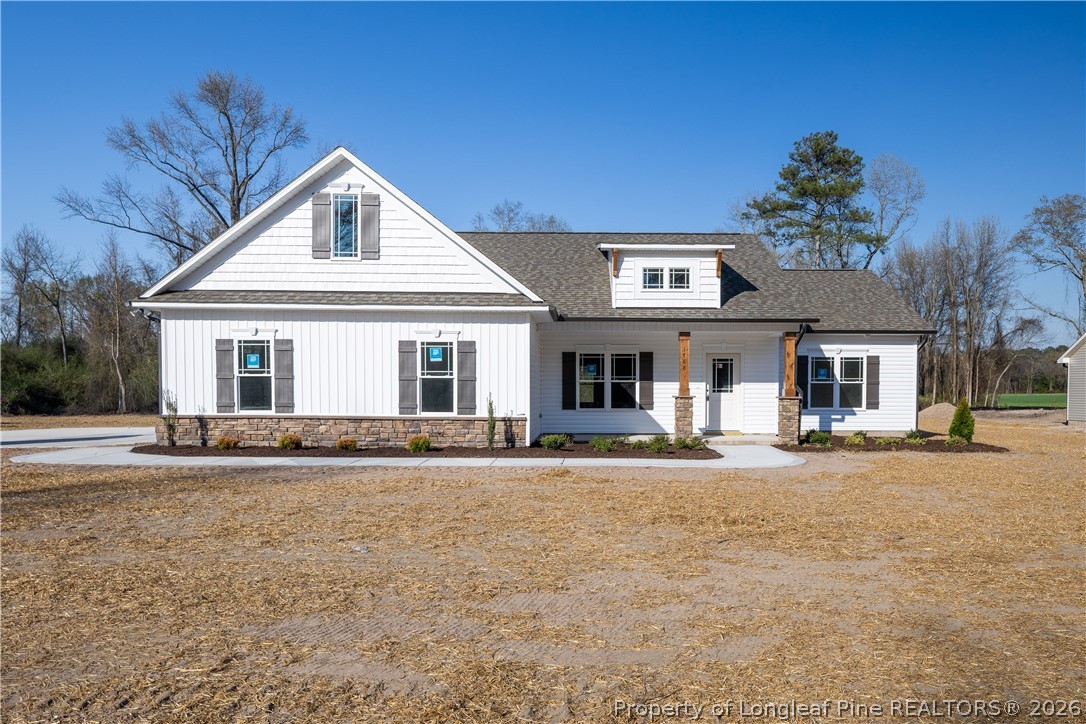1788 Alderman Mill Road Dunn, NC 28334 - Photo 1 of 14 a front view of a house with a yard