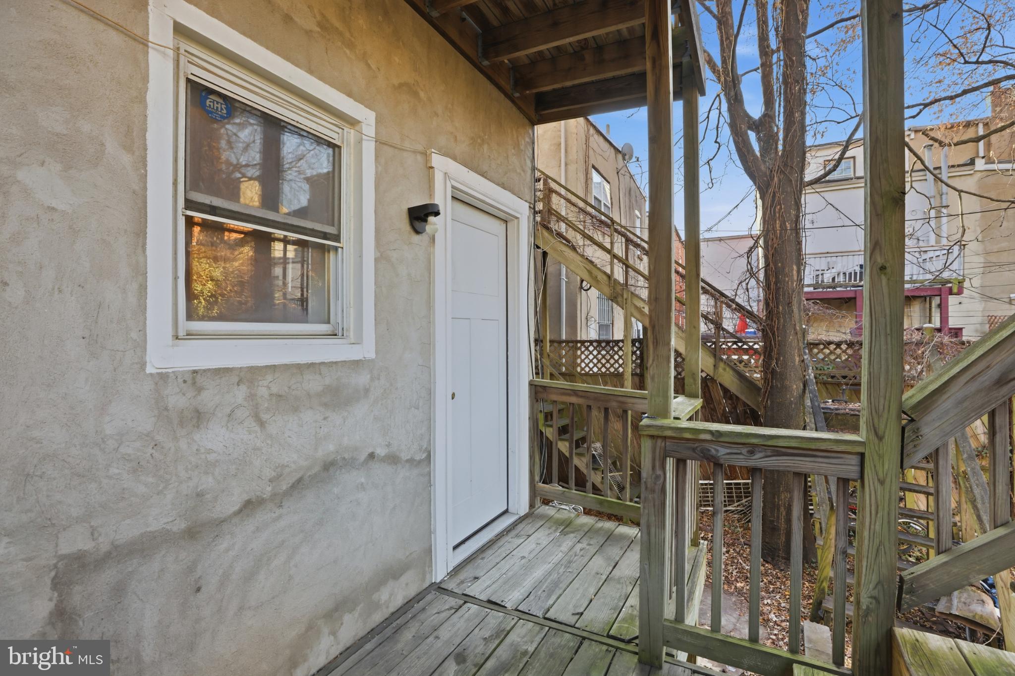 1912 9th Street Northwest, Unit 1 Washington, DC 20001 - Photo 17 of 18 Charming rear balcony with rustic wooden steps.