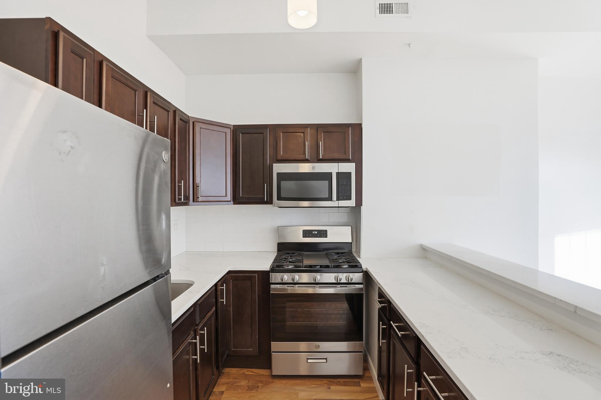 1912 9th Street Northwest, Unit 1 Washington, DC 20001 - Photo 8 of 18 Sleek modern kitchen with elegant finishes.