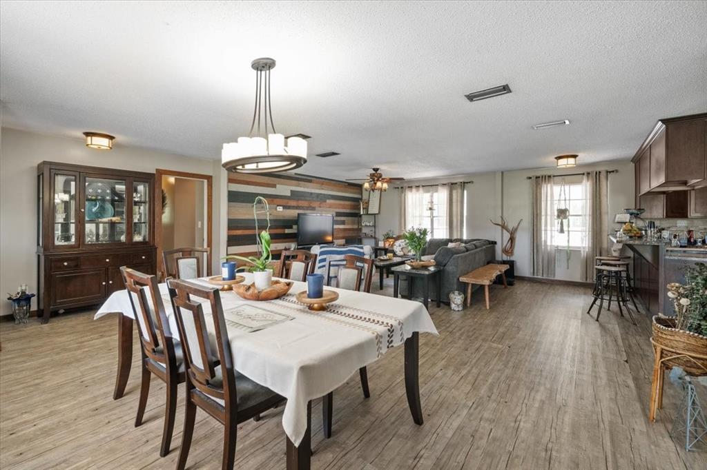 7422 County Road 231 Lake Butler, FL 32054 - Photo 6 of 57 a view of a dining room with furniture window and wooden floor