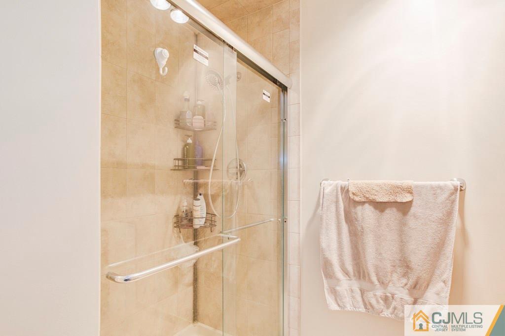 4401 Stonehedge Road, Unit 44 Edison, NJ 08820 - Photo 13 of 24 a bathroom with a shower
