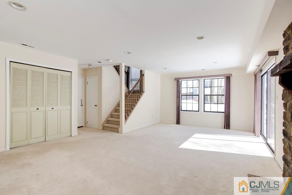 4401 Stonehedge Road, Unit 44 Edison, NJ 08820 - Photo 20 of 24 a view of an empty room with a window
