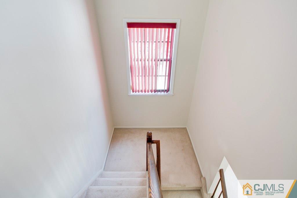4401 Stonehedge Road, Unit 44 Edison, NJ 08820 - Photo 10 of 24 a view of an entryway with staircase
