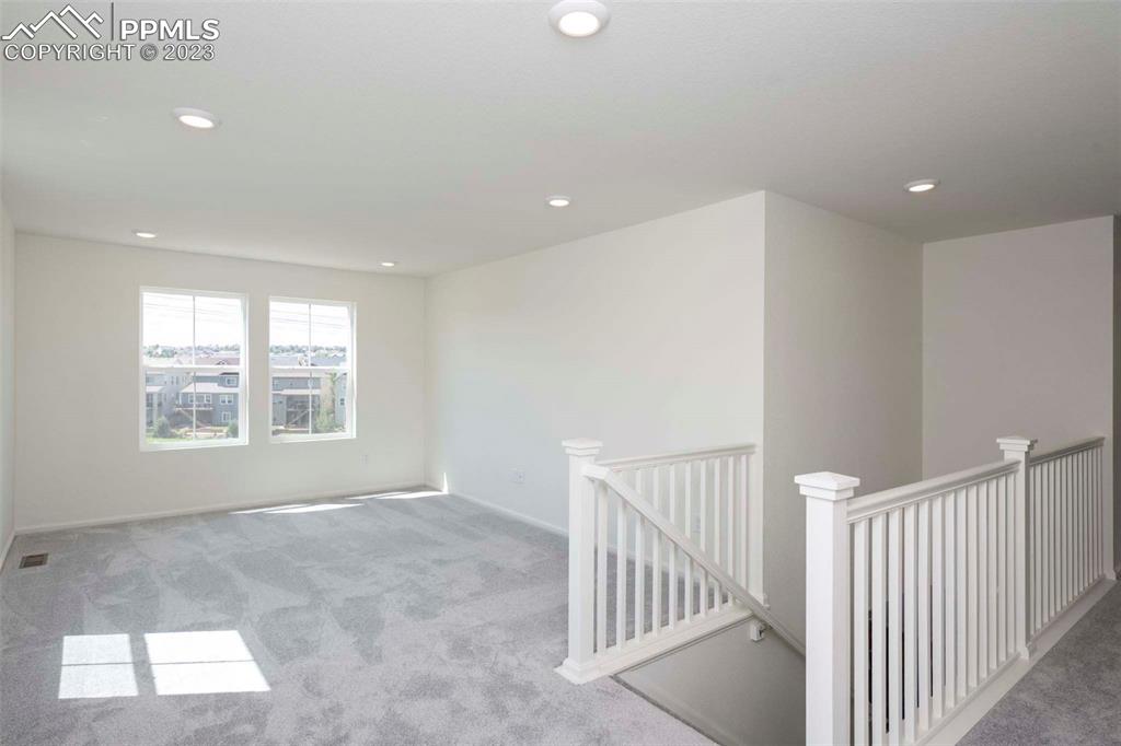 2050 Peachleaf Loop Castle Rock, CO 80108 - Photo 14 of 25 a view of an empty room with a window