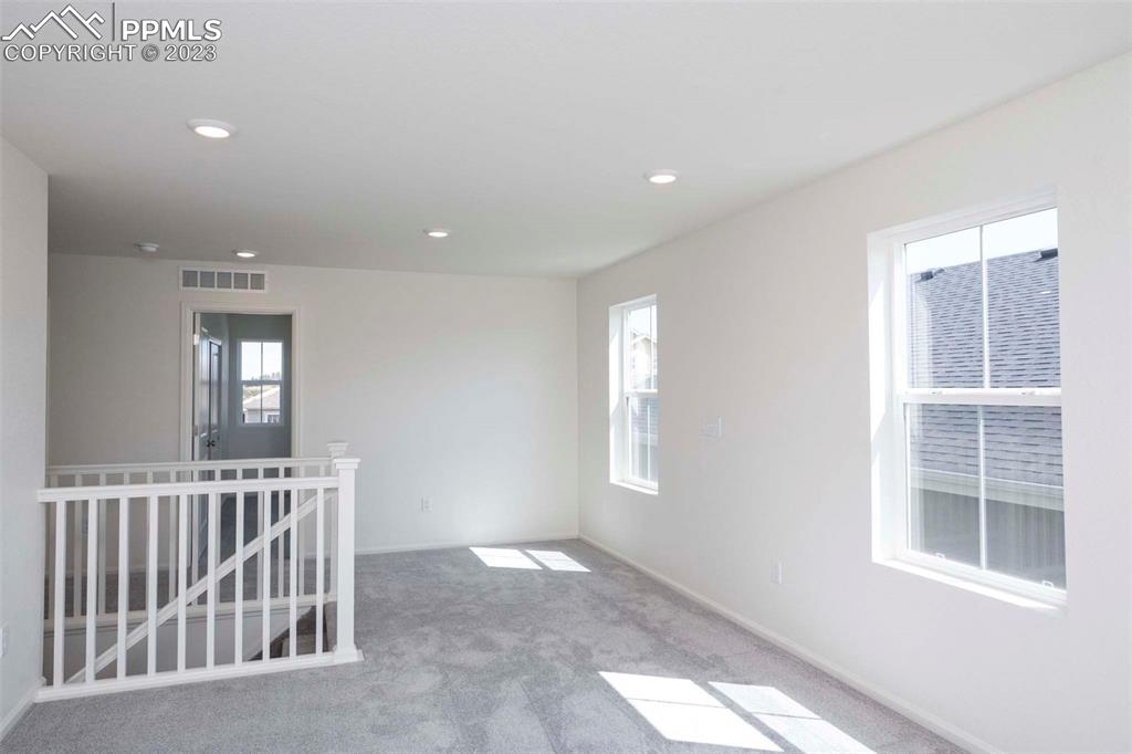 2050 Peachleaf Loop Castle Rock, CO 80108 - Photo 15 of 25 a view of an empty room and window