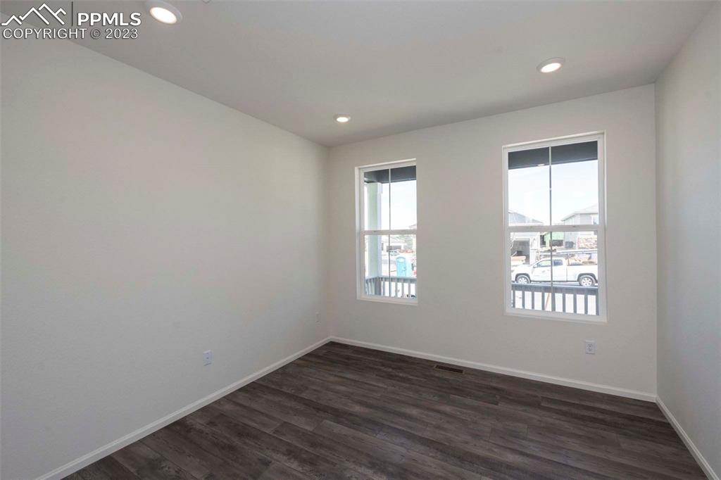 2050 Peachleaf Loop Castle Rock, CO 80108 - Photo 3 of 25 an empty room with wooden floor and windows