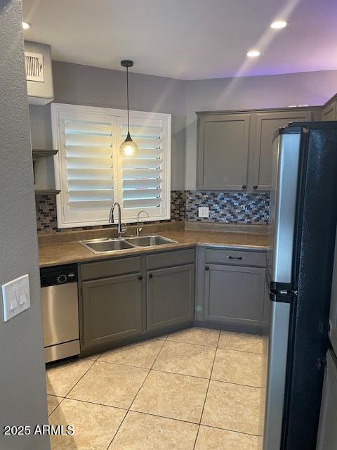 3848 North 3rd Avenue, Unit 1033 Phoenix, AZ 85013 - Photo 23 of 24 a kitchen with stainless steel appliances granite countertop a sink and cabinets