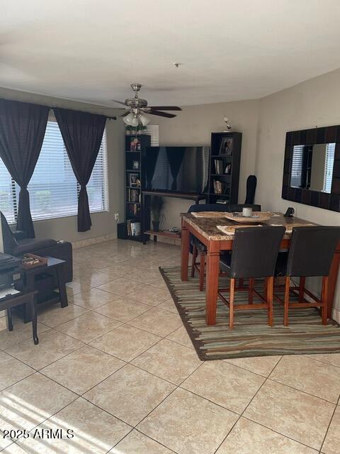 3848 North 3rd Avenue, Unit 1033 Phoenix, AZ 85013 - Photo 8 of 24 a living room with furniture a flat screen tv and kitchen view