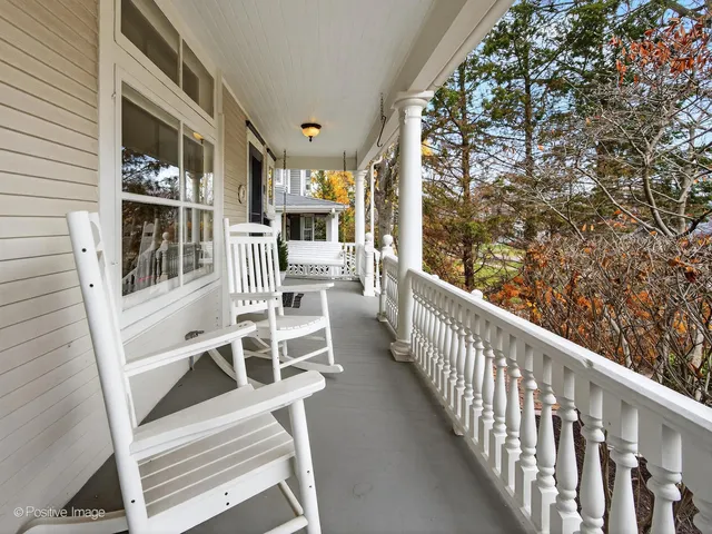 a view of a balcony with chairs