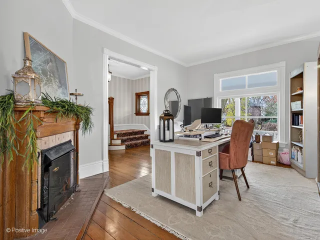 a view of a livingroom with furniture and a fireplace