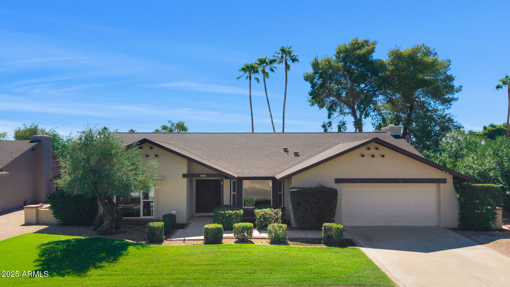 a front view of house with yard and outdoor seating