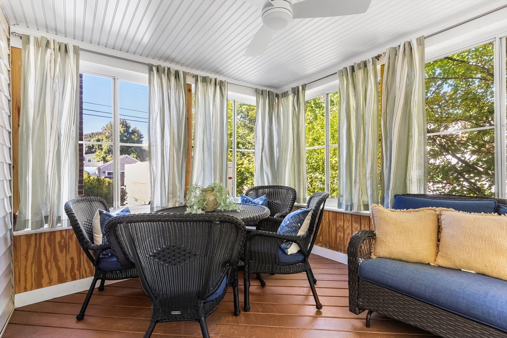 40 Bonad Road Stoneham, MA 02180 - Photo 12 of 38 a dining room with furniture a chandelier and wooden floor