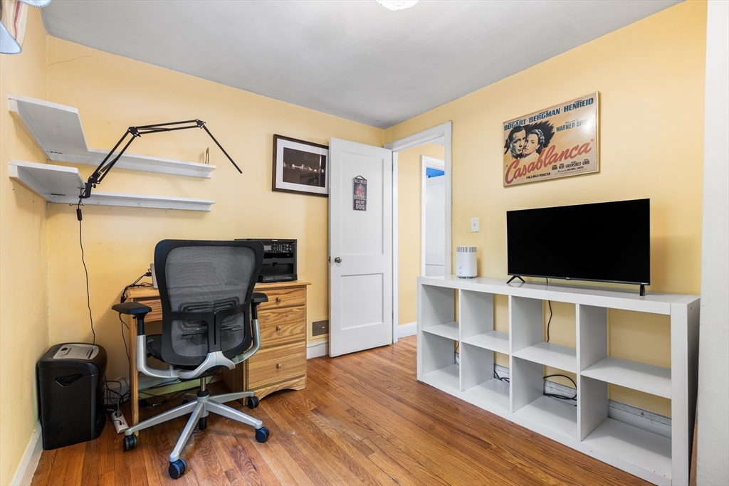 40 Bonad Road Stoneham, MA 02180 - Photo 13 of 38 a view of a workspace with furniture and wooden floor
