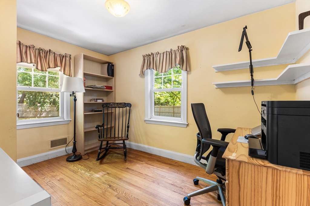 40 Bonad Road Stoneham, MA 02180 - Photo 14 of 38 a view of a workspace with furniture and a window
