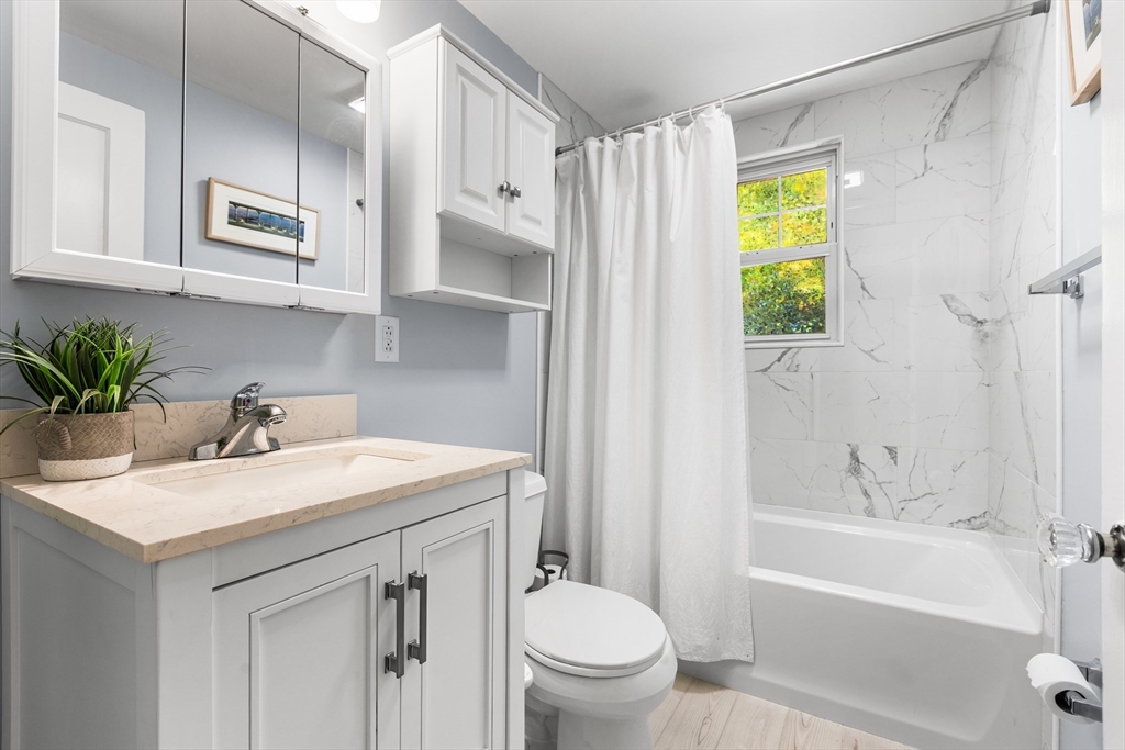 40 Bonad Road Stoneham, MA 02180 - Photo 15 of 38 a bathroom with a sink a toilet and a bathtub