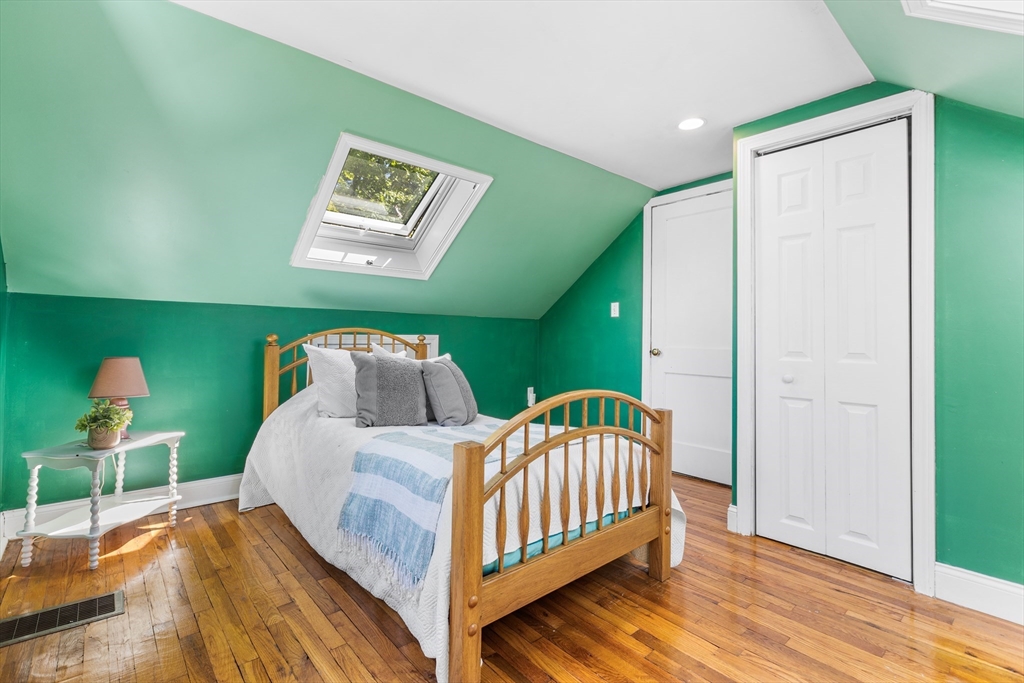 40 Bonad Road Stoneham, MA 02180 - Photo 18 of 38 a bedroom with two beds and a lamp on table