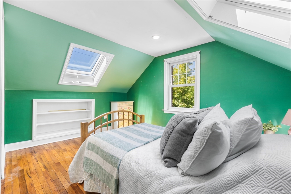 40 Bonad Road Stoneham, MA 02180 - Photo 19 of 38 a bed sitting in a bedroom next to a window