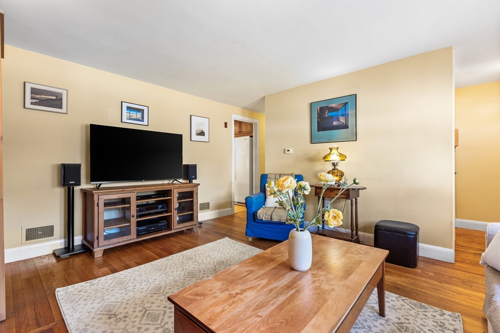 40 Bonad Road Stoneham, MA 02180 - Photo 4 of 38 a living room with furniture and a flat screen tv