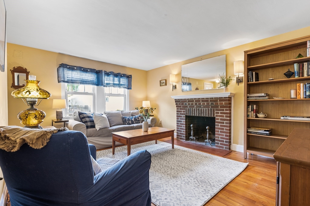 40 Bonad Road Stoneham, MA 02180 - Photo 5 of 38 a living room with furniture and a fireplace