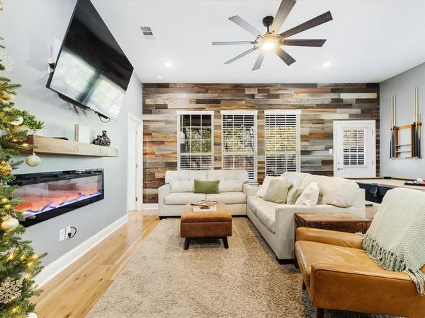 a room with furniture and a flat screen tv