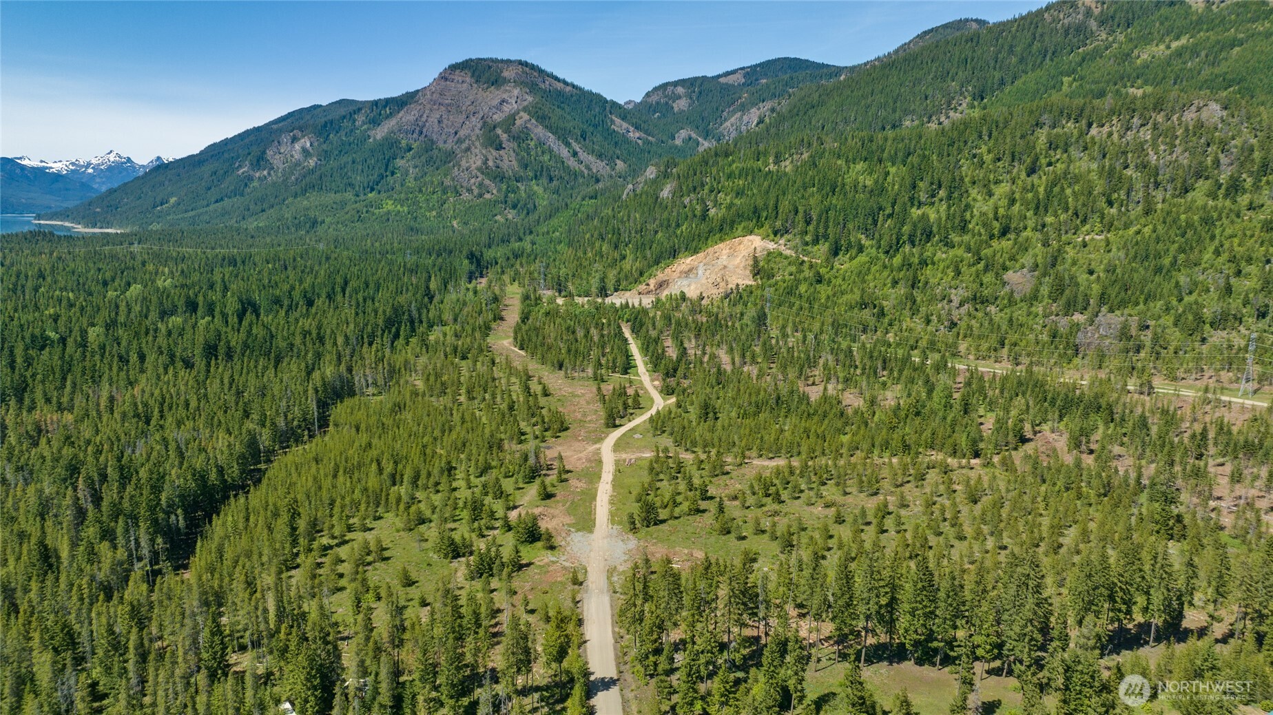 1 East Sparks Road Easton, WA 98925 - Photo 19 of 21 a view of a house with a lush green forest