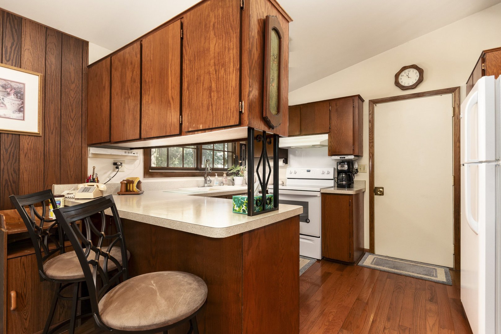 2S810 Bliss Road Batavia, IL 60510 - Photo 18 of 28 a kitchen with sink a refrigerator and chairs