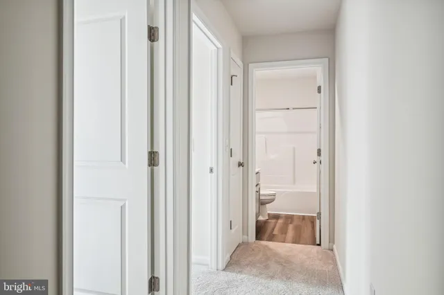 a view of a bathroom from a hallway