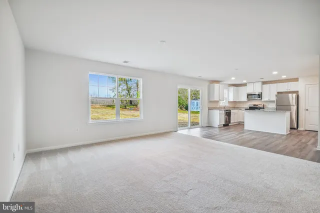 a view of a kitchen with a sink and a window