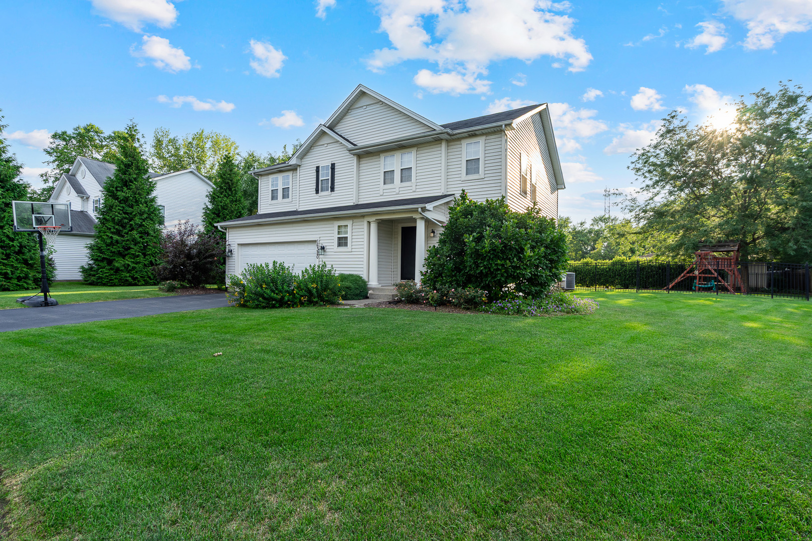 16320 Spring Creek Lane Plainfield, IL 60586 - Photo 1 of 40 a front view of a house with garden