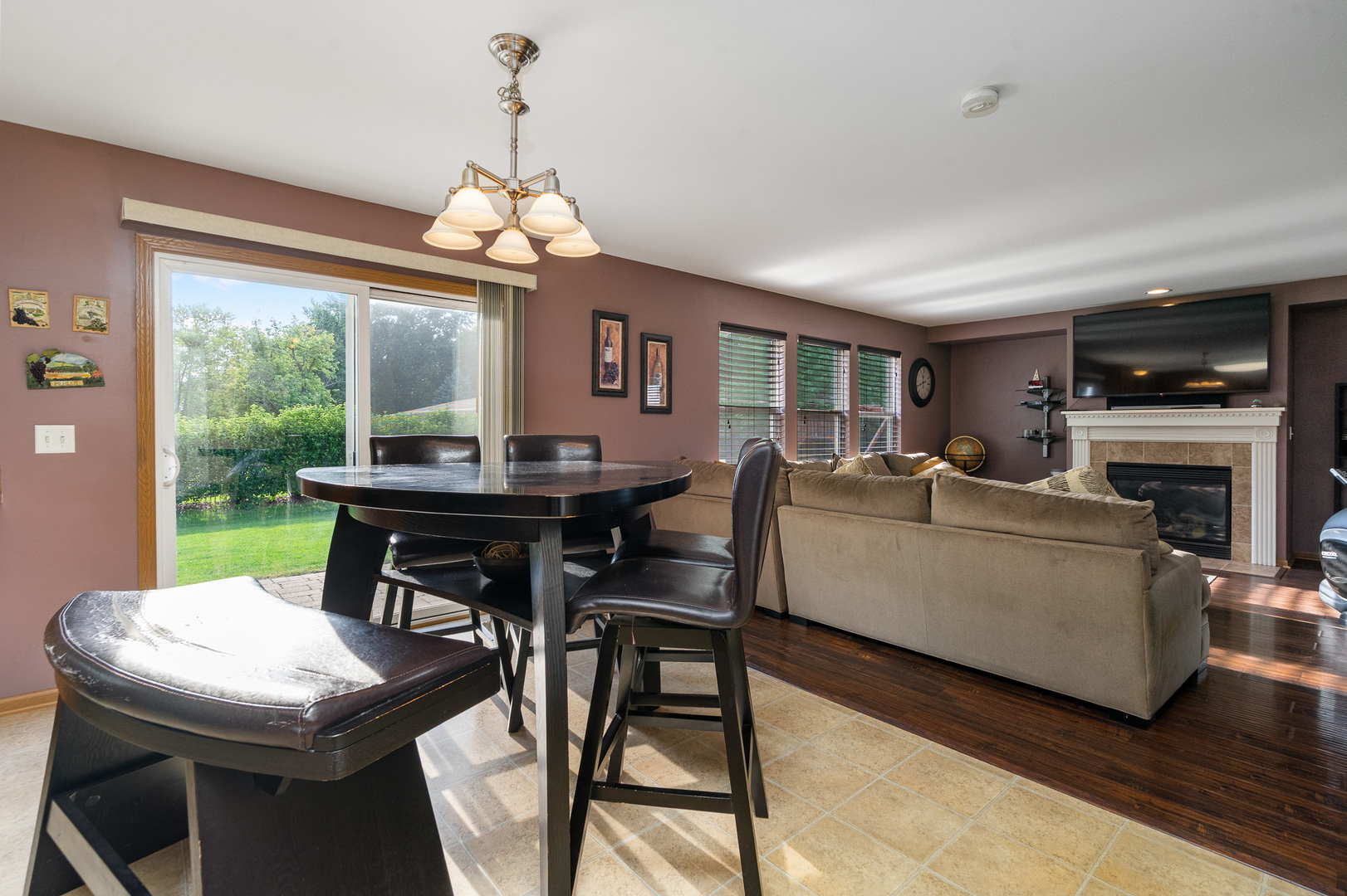 16320 Spring Creek Lane Plainfield, IL 60586 - Photo 12 of 40 a living room with furniture a window and a fireplace