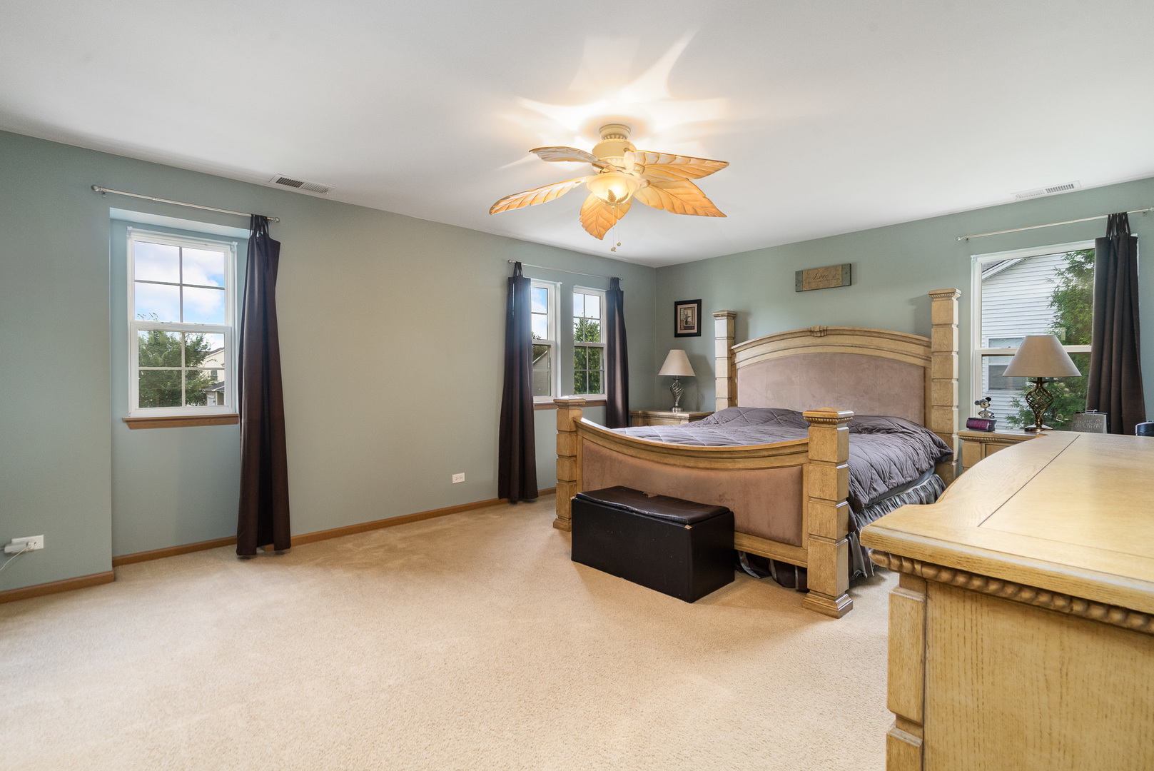16320 Spring Creek Lane Plainfield, IL 60586 - Photo 16 of 40 a view of a livingroom with furniture and a chandelier