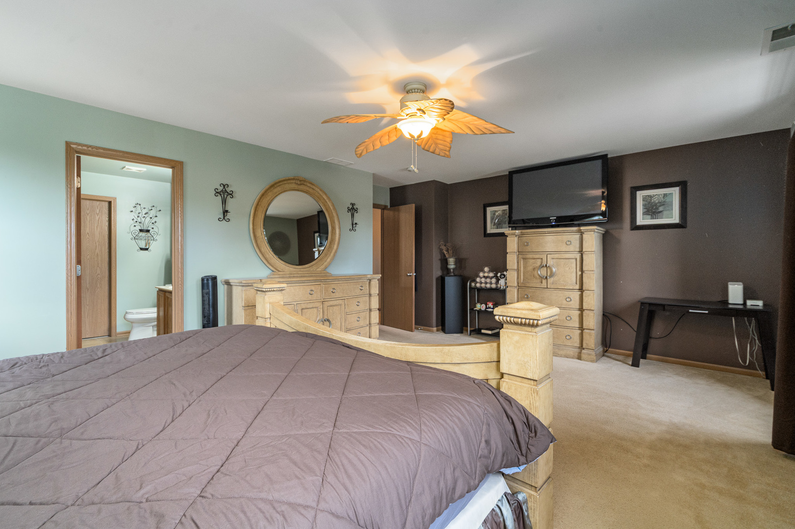 16320 Spring Creek Lane Plainfield, IL 60586 - Photo 17 of 40 a bedroom with a bed mirror and a window