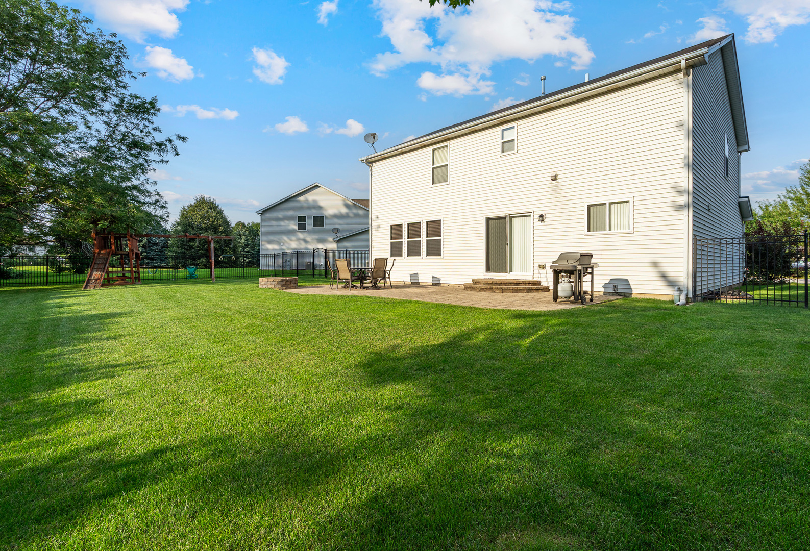 16320 Spring Creek Lane Plainfield, IL 60586 - Photo 26 of 40 a front view of a house with a yard and garage