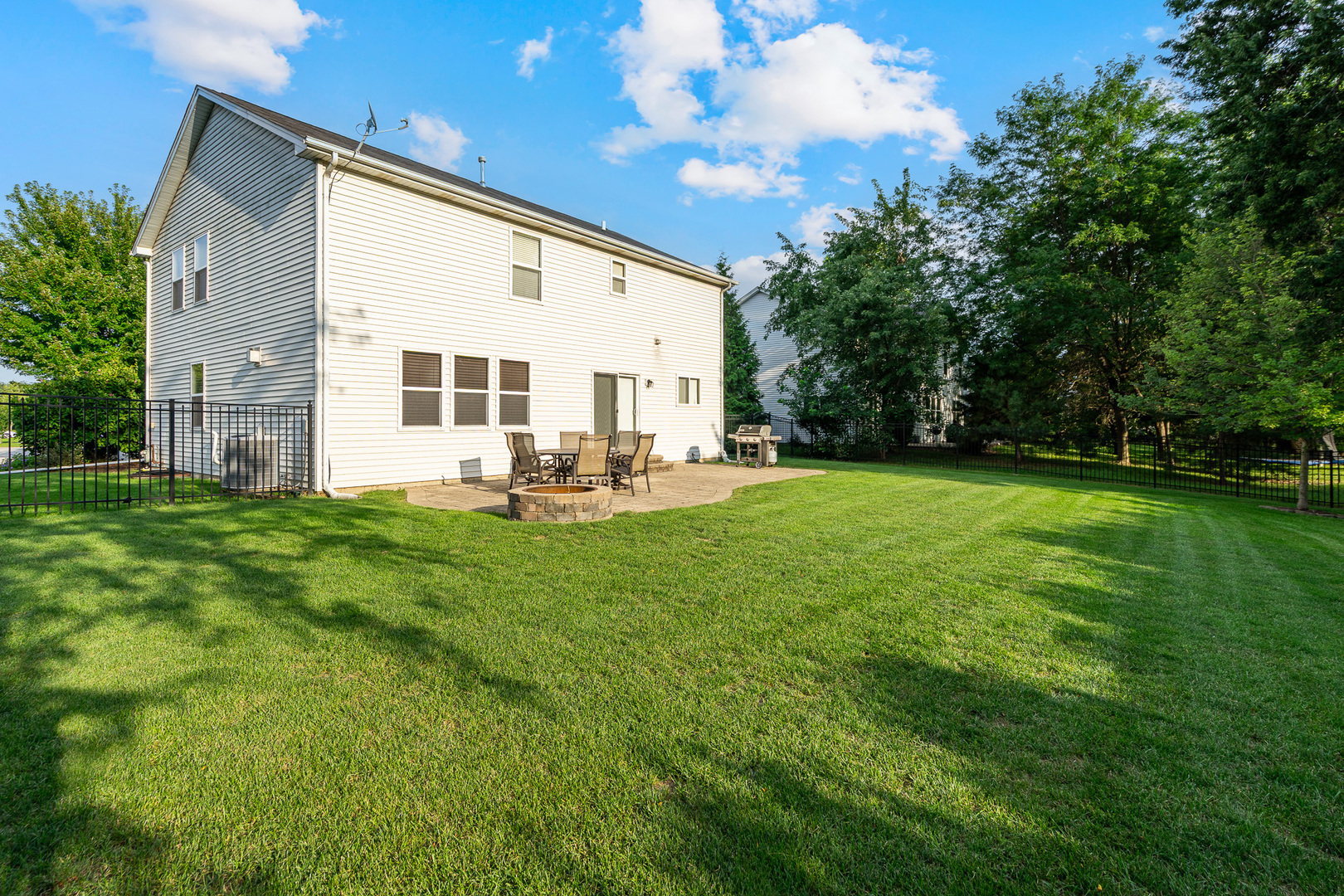 16320 Spring Creek Lane Plainfield, IL 60586 - Photo 31 of 40 a front view of a house with garden