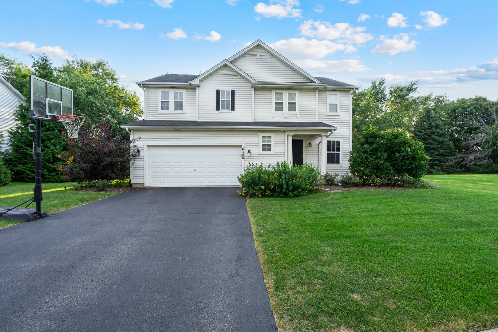 16320 Spring Creek Lane Plainfield, IL 60586 - Photo 40 of 40 a front view of house with yard and green space