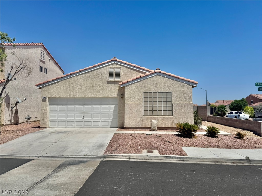 7340 Ridge Star Court Las Vegas, NV 89131 - Photo 1 of 22 A classic stucco home with a two-car garage awaits on a low-maintenance lot.