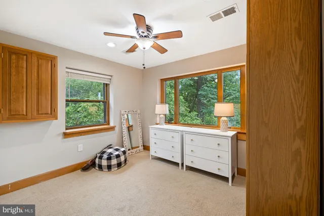 a view of a livingroom with furniture and a window