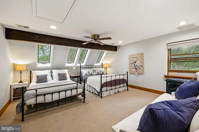 a bedroom with furniture and window