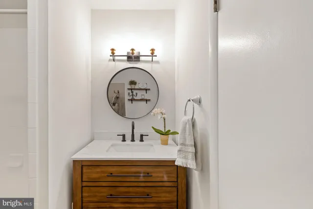 a bathroom with a sink and a mirror