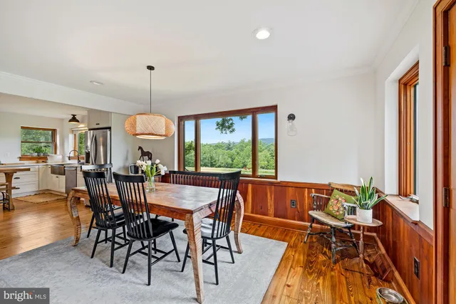 a view of a dining room with furniture window and outside view
