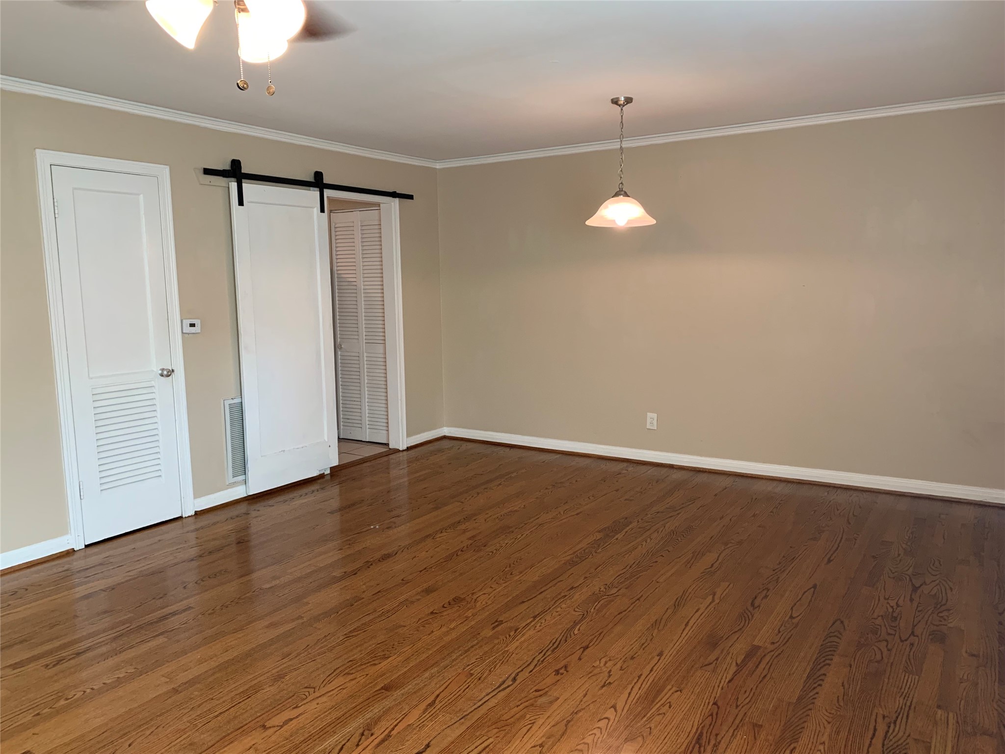 307 Avondale Street, Unit 1 Houston, TX 77006 - Photo 6 of 22 Barn Door to Kitchen. Extra closet in living room. Central AC & Heat. Free Water utility included.