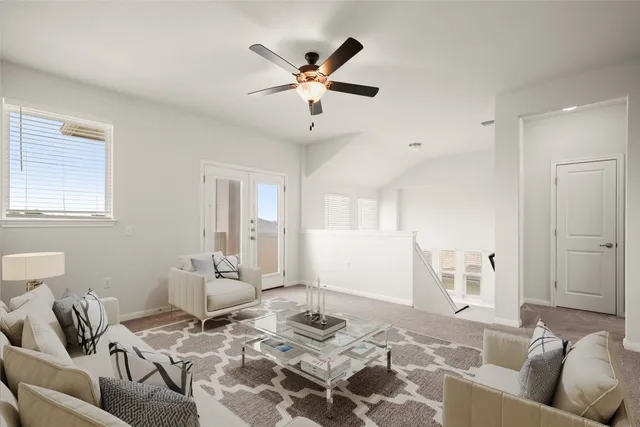 a living room with furniture and window