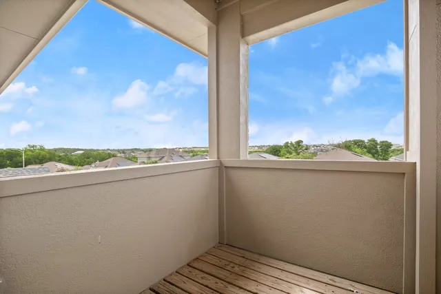 a view of balcony with furniture