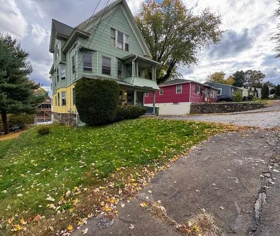 a aerial view of a house with swimming pool