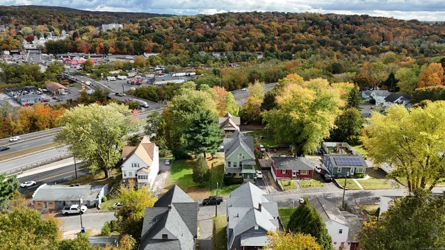 a view of a kitchen with a sink and refrigerator