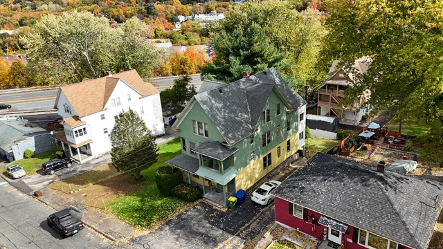 a aerial view of a house with a yard